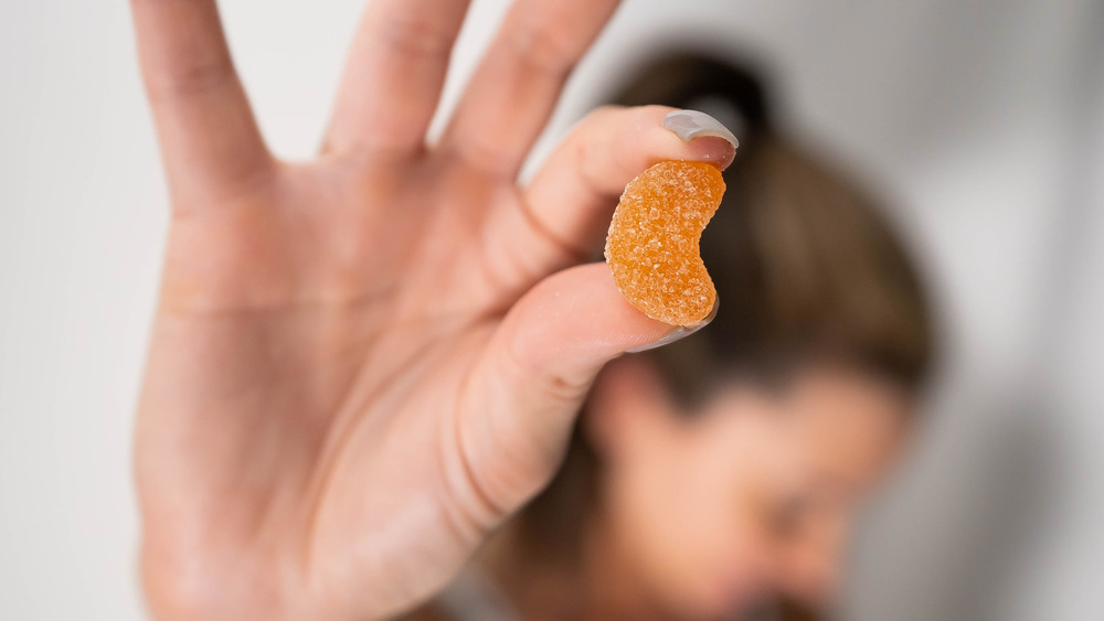 woman with CBD gummy