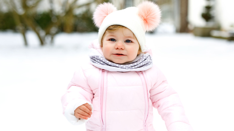 baby walking in the snow