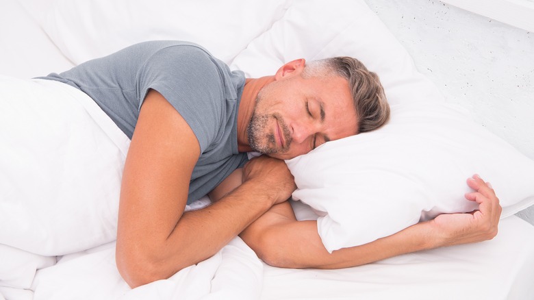 man sleeping on his left side