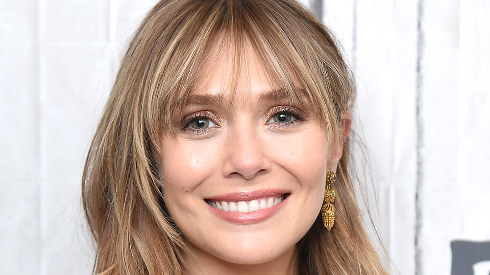 A close up of Elizabeth Olsen smiling at a Build series event