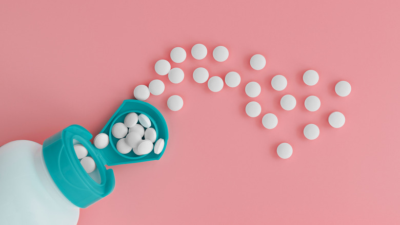 bottle with pills spilling out