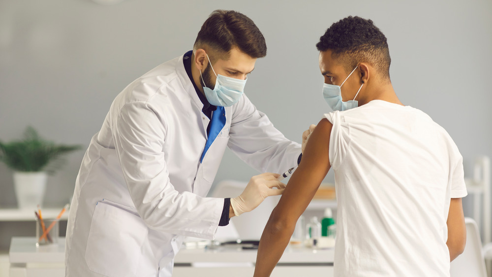 Man getting COVID-19 vaccine