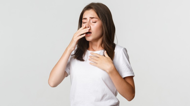 Woman just about to sneeze