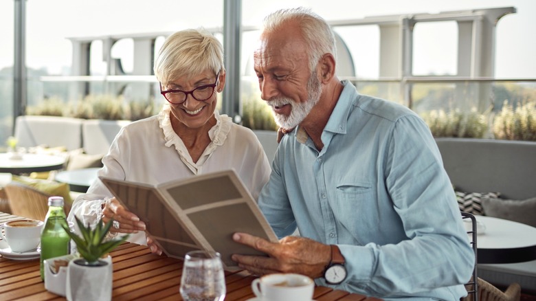 older couple perusing menu