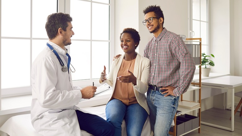 Couple getting professional help from their doctor. 