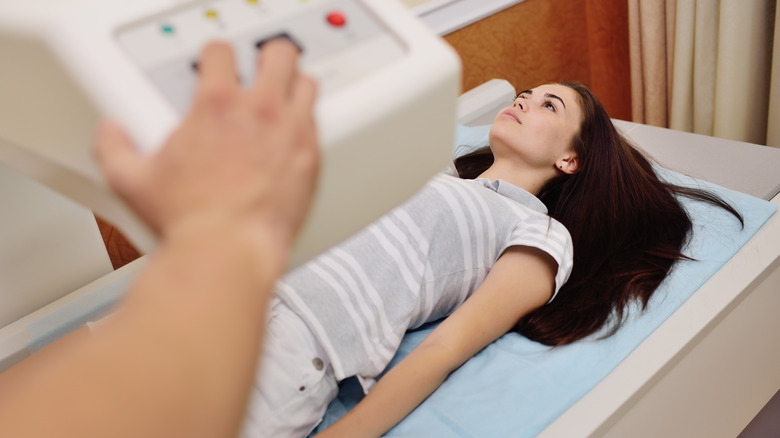 woman getting bone density test