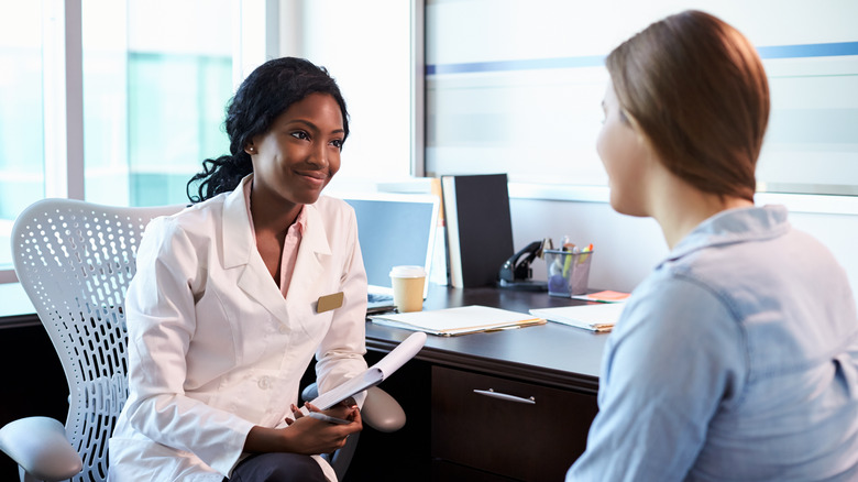 woman and doctor talking