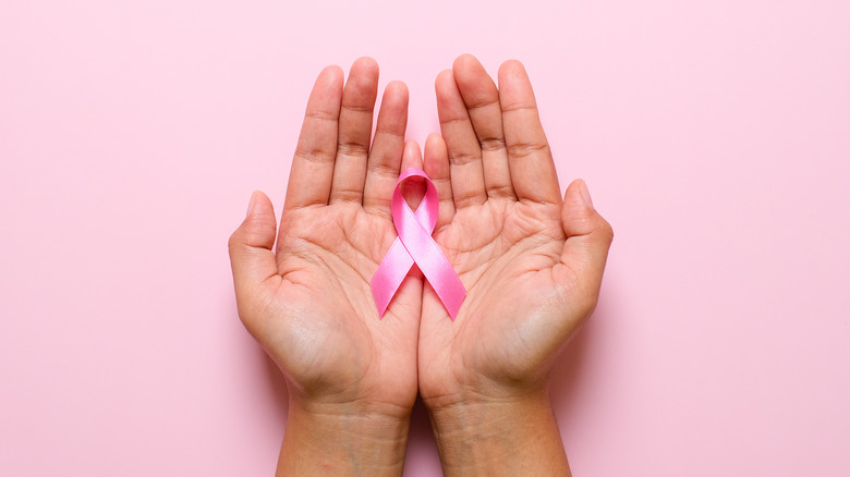hands holding breast cancer awareness ribbon