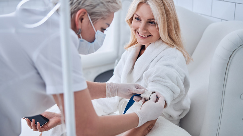 woman receiving IV therapy