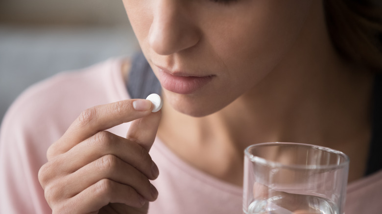 woman taking medication