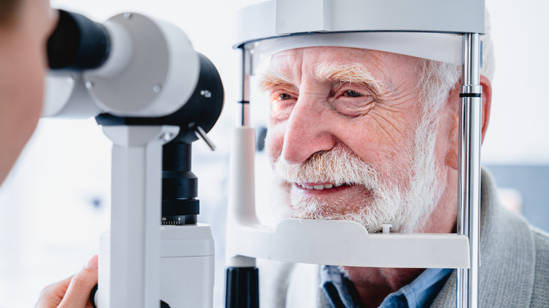 Close up photo of senior male patient during eye examination