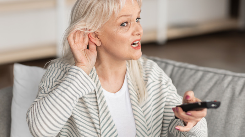 A woman struggling to hear 