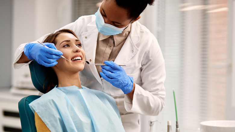 A woman is at the dentist