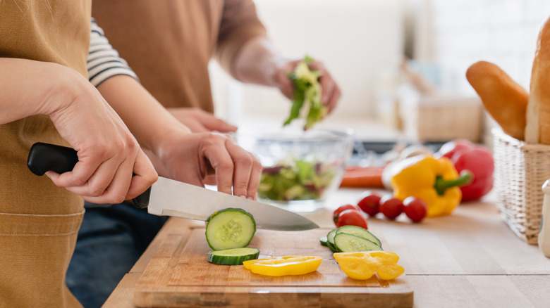 couple cooking in kitchen