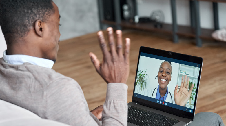 man in virtual visit with doctor