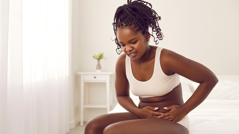 Woman with stomach ache cramps