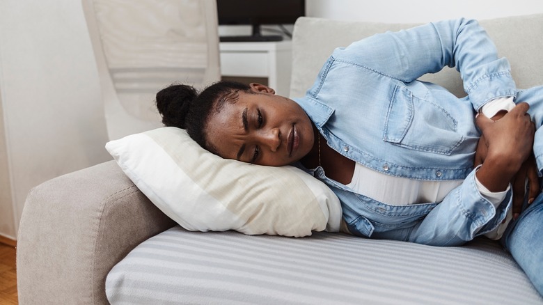 Woman with stomach ache cramps