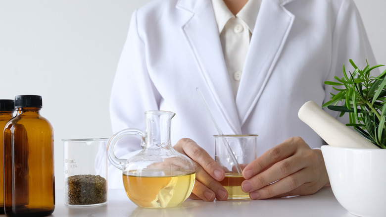 Lab doctor holding supplement ingredients