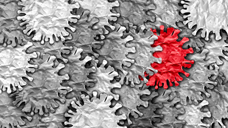 COVID-19 virus cells in gray, red