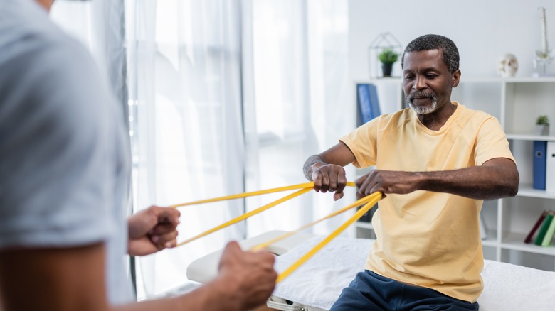 An older man exercises