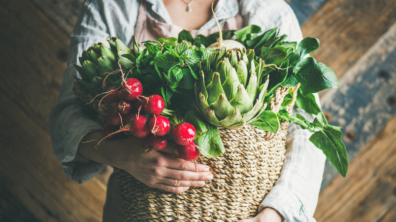 Woman with basket of veggies