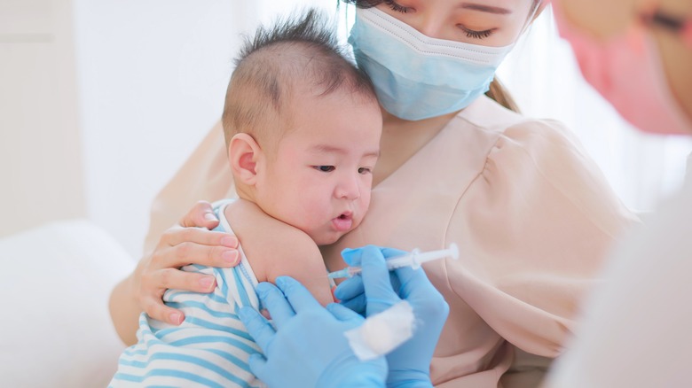 Young baby receiving vaccine 