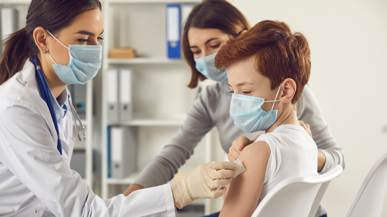 Boy getting COVID vaccine 