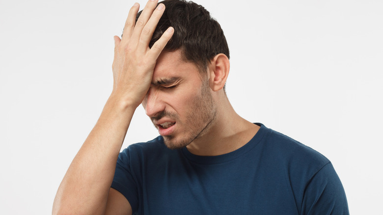 Man palm on head