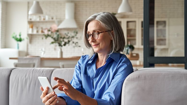 Woman reading about risk factors for stroke