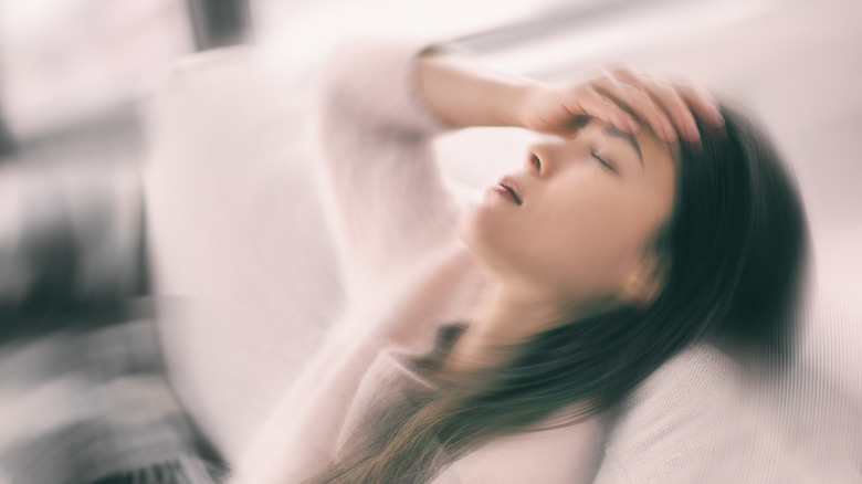 Woman suffering from a severe migraine