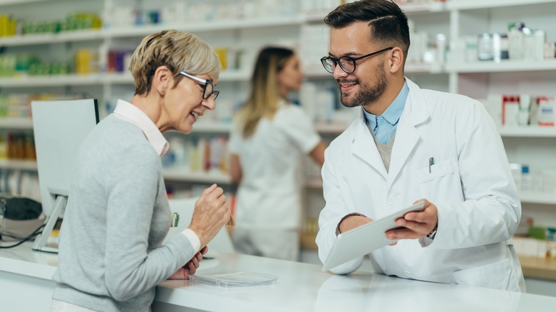 a female customer and male pharmacist