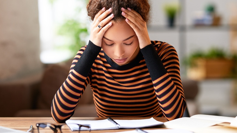 stressed woman reading notes