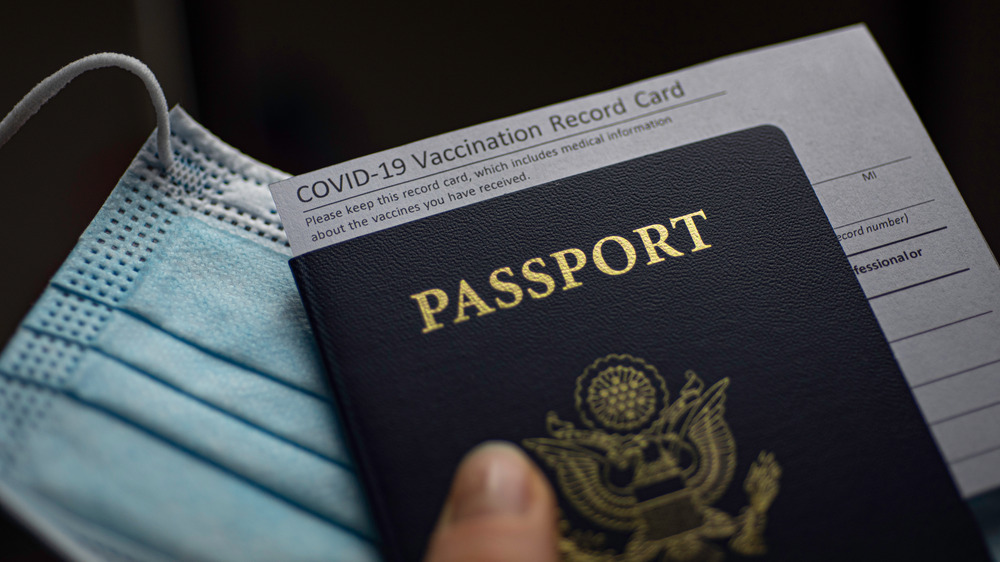 A COVID-19 medical card tucked in a US passport 