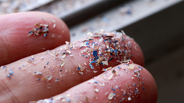 Microplastics on fingers