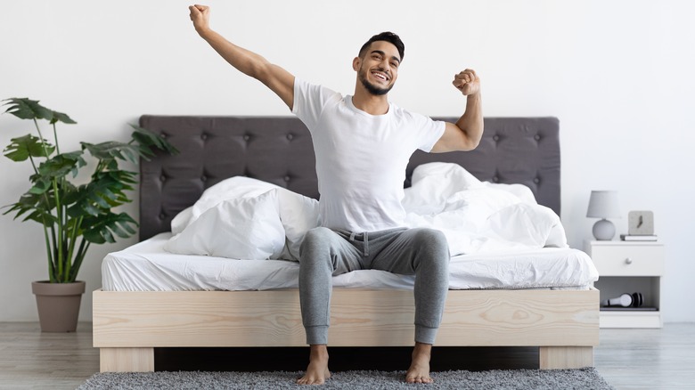 man stretching after waking up