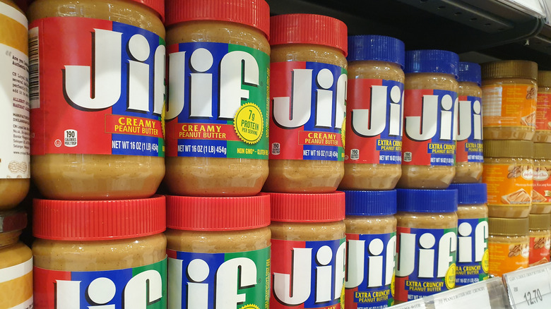 Rows of Jif Peanut Butter jars on grocery store shelf