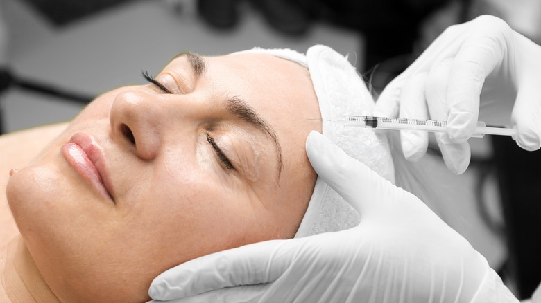 Woman receiving botox injection