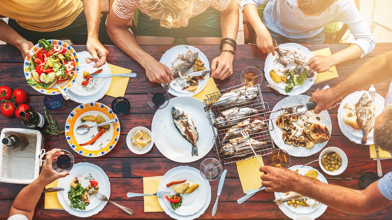 wooden table covered in different foods