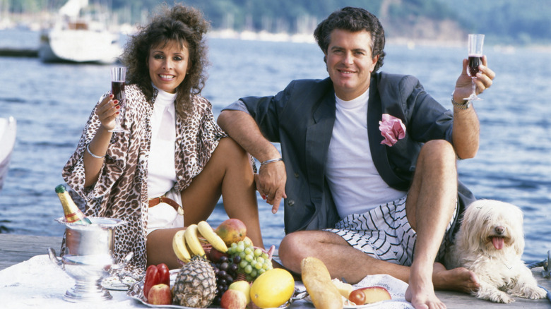 '80s couple on a pier with a platter of fruit