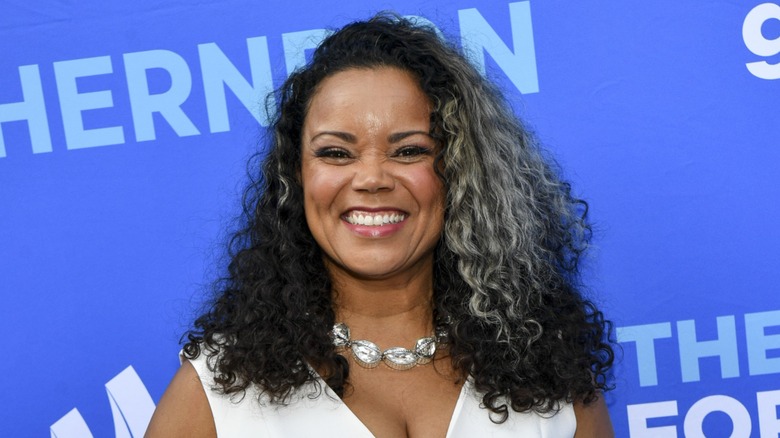 Kimberly Locke in a white dress at a celebrity event