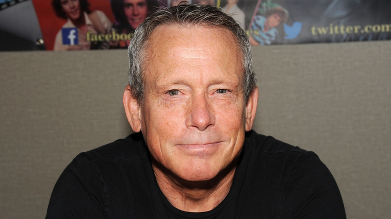 actor Willie Aames smiling casually in a photo