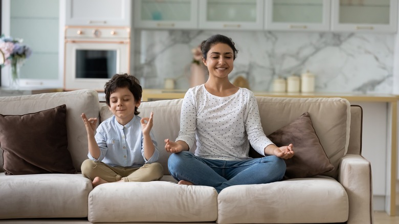 Mother and child meditating 