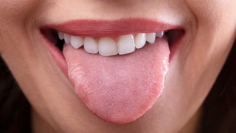 Close-up of woman's face with tongue sticking out