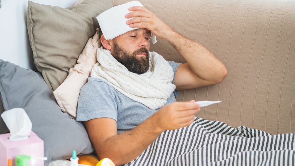 man sick with fever
