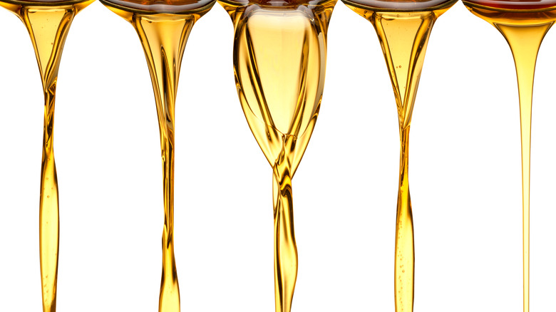 close up of drizzling oil 