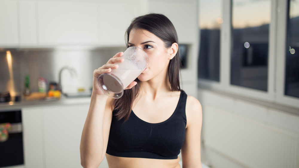 woman drinking protein shake