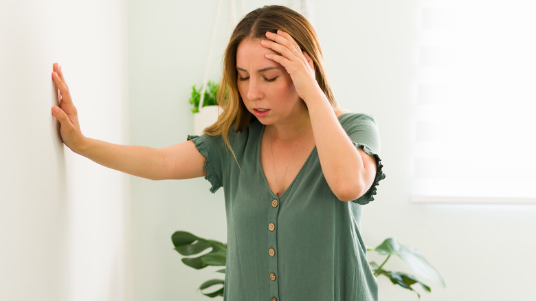 Woman dizzy after standing up