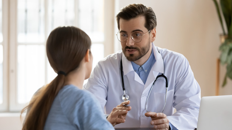 Doctor talking with patient