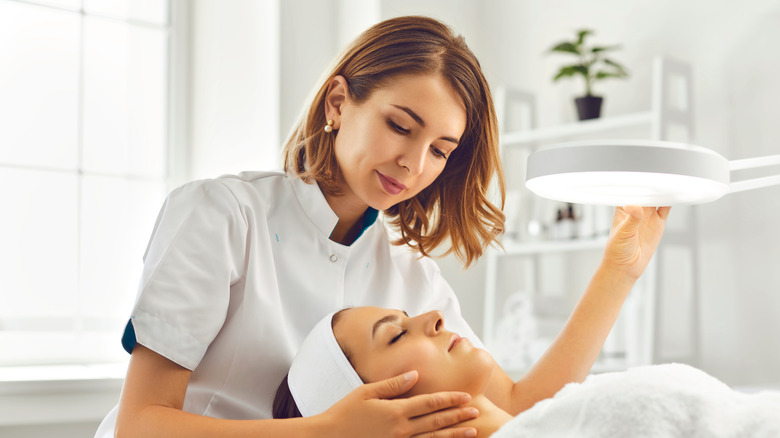 dermatologist helping a patient