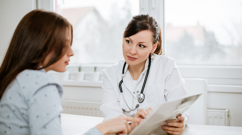 Female patient and doctor